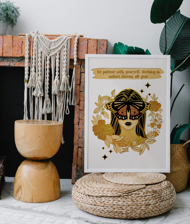 Be Patient with Yourself print framed above a bed