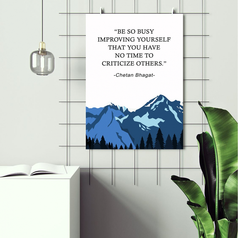 Be So Busy Improving Yourself print framed above a desk