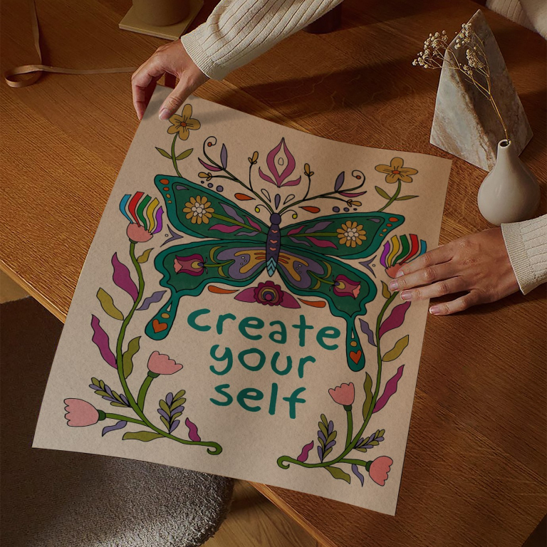 Create Yourself print framed above a bed