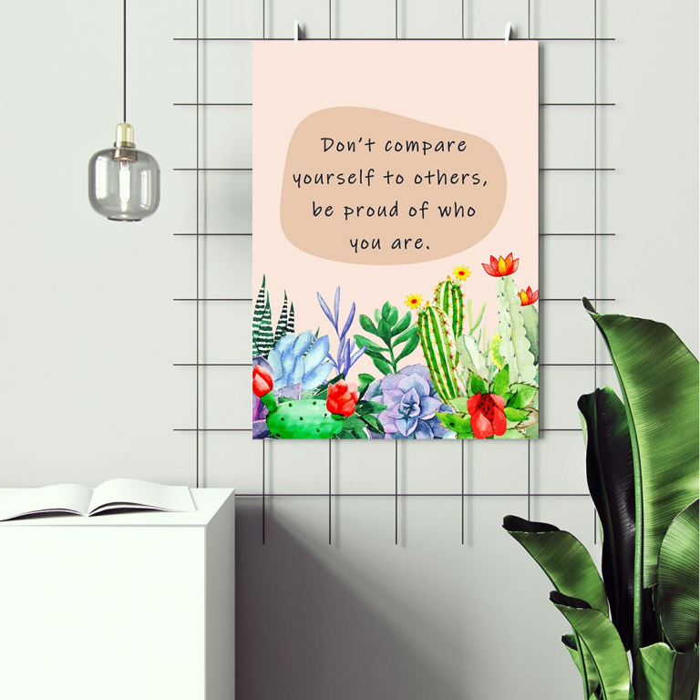 Don't Compare Yourself print framed and displayed in a classroom