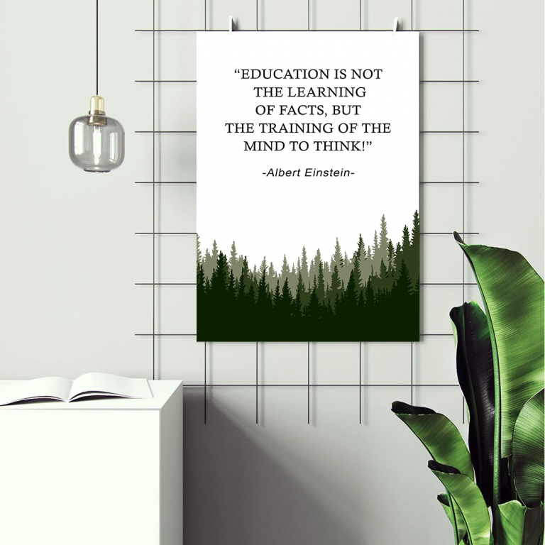 Education Trains the Mind print framed above a desk