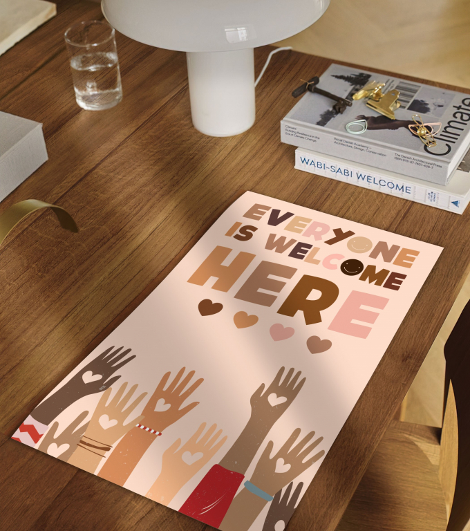 Everyone Is Welcome Here boho print framed and displayed in a classroom