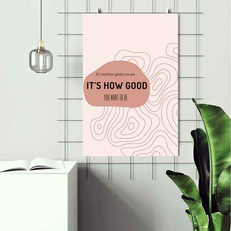 It's How Good You Want to Be print framed above a desk