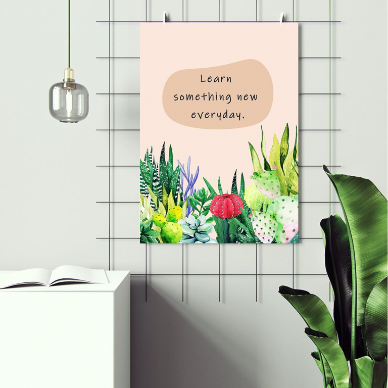 Learn Something New print framed and displayed in a classroom