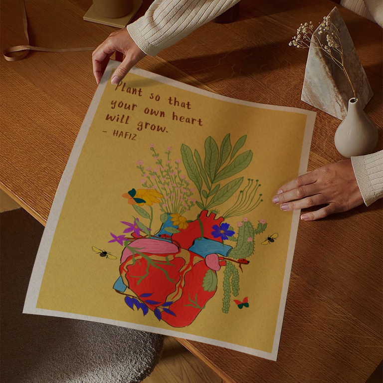 Plant Your Own Heart print framed above a bed