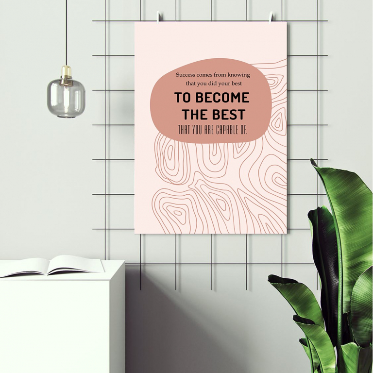 To Become the Best print framed above a desk